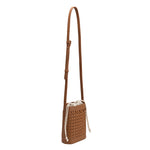 A small saddle woven vegan leather crossbody pouch with a drawstring closure.