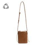 A small saddle woven vegan leather crossbody pouch with a drawstring closure.